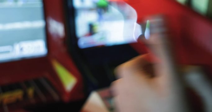 Arcade: Anonymous Woman Playing Shooting Video Game