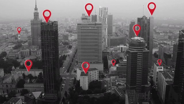 Aerial shot of Warsaw city center with localization icons.