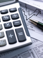 Financial concept. Calculator and pen.