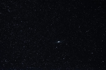 Starry sky summer night with the Andromeda nebula