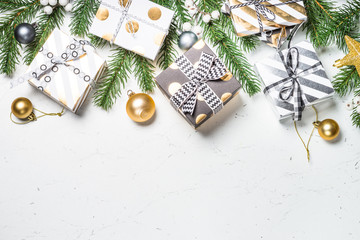 Christmas background with Gold present box and decorations.