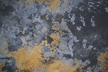 Gray golden texture of decorative plaster for walls and concrete. seamless background