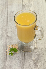 Dietary vegetarian oats milk over wooden