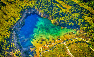 Aerial landscape from the drone - blue water inside old mine