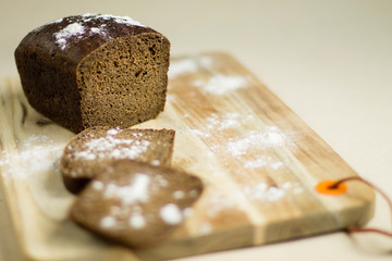black bread on a wooden Board