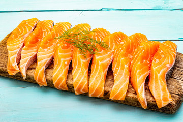 Slices of fresh salmon. Ingredient for cooking healthy seafood. Concept omega 3 containing food