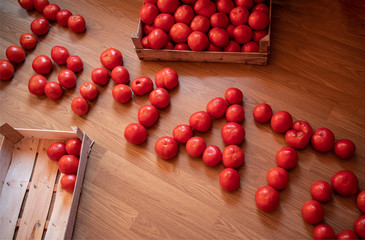 Word TOMATO made of raw fresh organic tomatoes