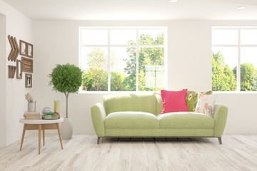 Stylish room in white color with sofa and summer landscape in window. Scandinavian interior design. 3D illustration