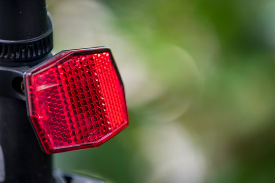 red reflex reflector on a bicycle