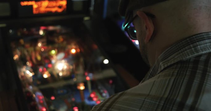 Arcade: Rear View Anonymous Hipster Playing Pinball