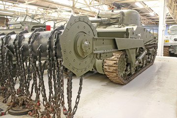 Vintage military tank with mine flail