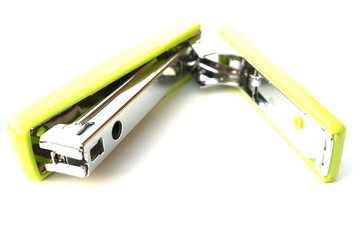 Green stapler isolated on white background.