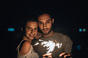 Christmas sparkler on black background. Bengal fire, low key, dark image