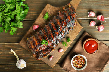 Grilled pork ribs on cutting board