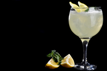 ALCOHOLIC DRINK WITH FRUIT COCKTEL on black background