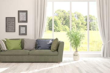 Stylish room in white color with sofa and summer landscape in window. Scandinavian interior design. 3D illustration