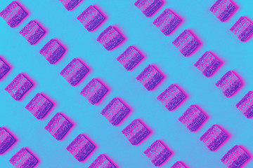 Colorful candies pattern on a pink background.