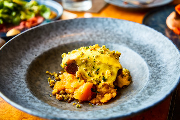 Beef stew with pumpkin and cheese crust.