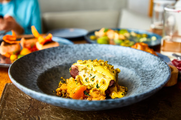 Beef stew with pumpkin and cheese crust.