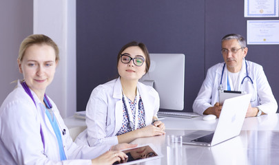 Doctors having a medical discussion in a meeting room