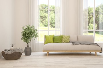 Fototapeta premium Stylish room in white color with sofa and summer landscape in window. Scandinavian interior design. 3D illustration