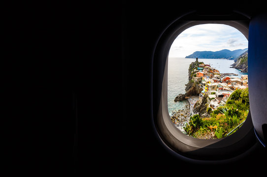 Italy looking out an airplanes porthole window during a flight , image using for sky and interior airplane concept
