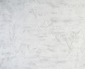 fragment of a cement background from white and gray paint with cracks