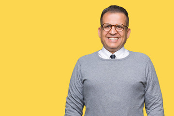 Fototapeta premium Middle age bussines arab man wearing glasses over isolated background with a happy and cool smile on face. Lucky person.