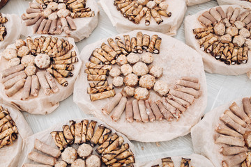 Top view of tasty fresh rolls and meatballs made of meat and vegetables served on round platter for catering event wedding special occasion.
