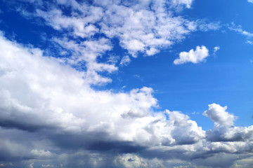 Obraz premium White beautiful fluffy clouds on blue sky background. The blue sky concept