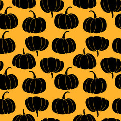 Seamless pattern with black silhouette of pumpkins on orange background. Art can be used for halloween.