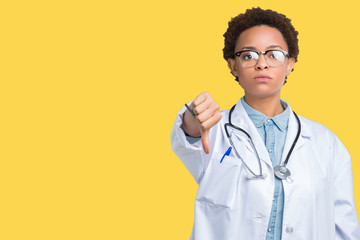 Young african american doctor woman wearing medical coat over isolated background looking unhappy and angry showing rejection and negative with thumbs down gesture. Bad expression.