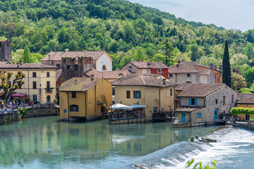 Fototapeta na wymiar Landscape of little italian town by the river