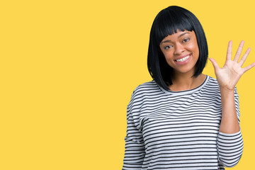 Beautiful young african american woman wearing stripes sweater over isolated background showing and pointing up with fingers number five while smiling confident and happy.