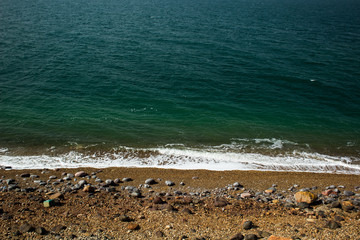 top view sand stone beach scenery landscape background texture landscape with sea blue water 