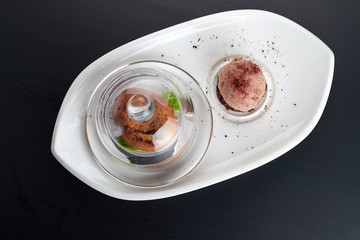 Caramel fondant on a white dish with an ice-cream
