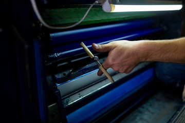 The master have service an industrial offset printing press machine. The process of tuning the...