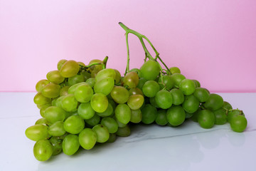 white grape on pink background