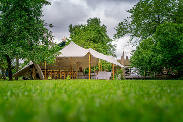 Image of huge tent for a wedding event in the nature