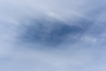 Blue sky in blurry cirrus clouds. Space for text.