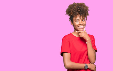Beautiful young african american woman over isolated background looking confident at the camera...