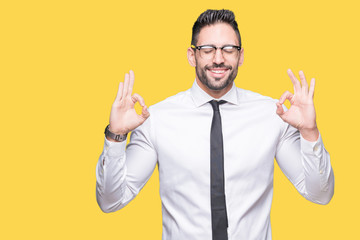 Young handsome business man wearing glasses over isolated background relax and smiling with eyes closed doing meditation gesture with fingers. Yoga concept.