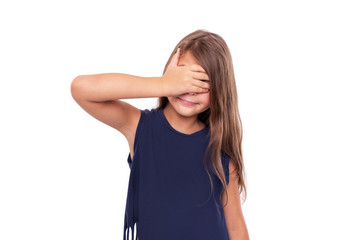 Little girl closed her eyes with her hand. Isolated on white.