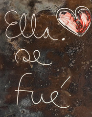 Havana, Cuba – 2019. Message on rusty metal – ella se fue (she left)