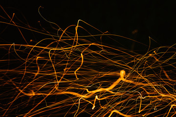  texture with sparks from coal. sparks fly on a black background