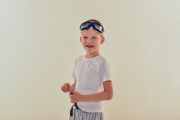 Funny boy in pilot's glasses, dreams of adventures. concept of traveling romance and discovery