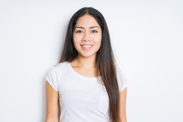 Obraz premium Beautiful brunette woman over isolated background with a happy and cool smile on face. Lucky person.