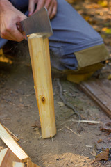 Man chopping wood chips for a fire