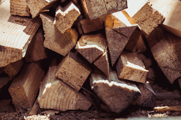 Natural wooden background, closeup of chopped firewood. Pile of wood logs
