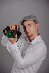 Young man using a professional camera